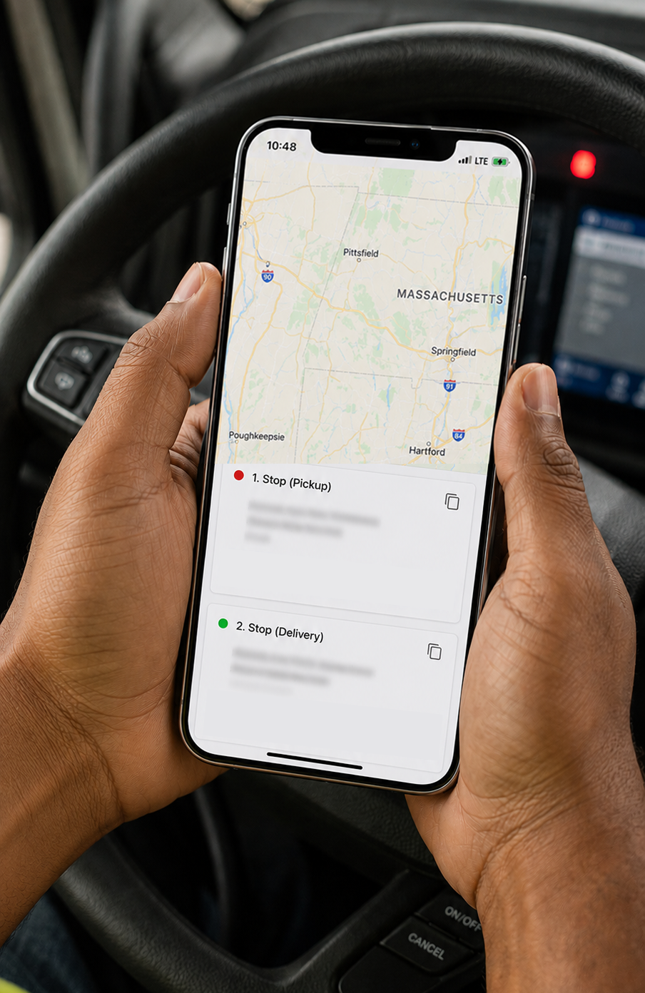 RovexOne Driver app showing an assigned load with pickup, delivery, and status buttons